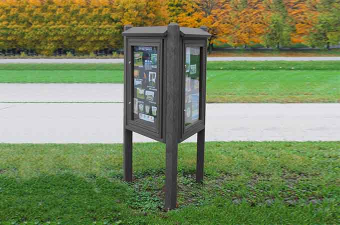 3 Sided Kiosk message Center in color charcoal installed in a public area
