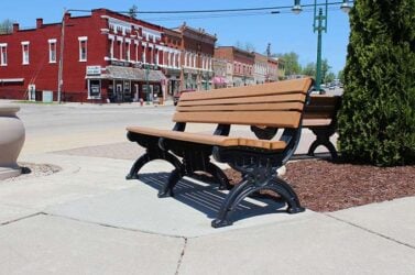Cambridge 6 foot Outdoor Bench, part of Polly Products' Green-Scapes recycled plastic outdoor furniture collection, placed along the Grand Ledge downtown business district.