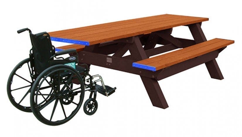A Deluxe ADA outdoor picnic table with wheelchair access on one end. Made of recycled HDPE plastic. Shown with a brown frame and cedar top and seat boards.