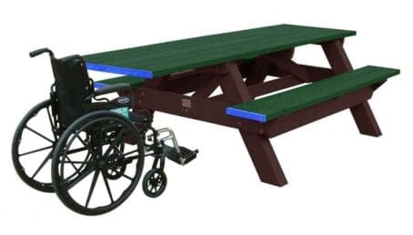 A Deluxe ADA outdoor picnic table with wheelchair access on one end. Made of recycled HDPE plastic. Shown with a brown frame and green top and seat boards.