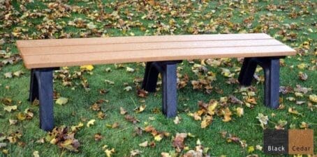 The Economizer Traditional 6 ft flat bench is made from 100% recycled HDPE plastic. This bench has the same design as our Traditional flat bench but uses our lighter weight 1 1/4"x5" planks instead of the standard 2"x6" planks. The bench is shown on grass with a black frame and cedar seat boards.