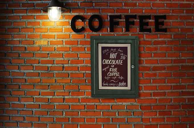 Green Menu Enclosure at coffee shop displaying menu & options