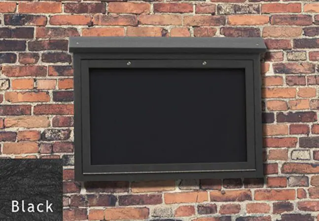Black Medium Message Center mounted on a brick wall