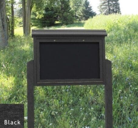 Medium Message Black 2 Sided with 2 Posts sunny day at public park and grass background