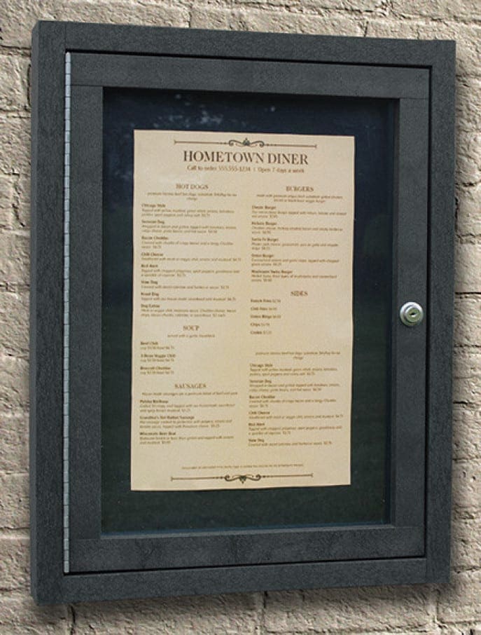 Black Menu Enclosure mounted on brick wall displaying diner options