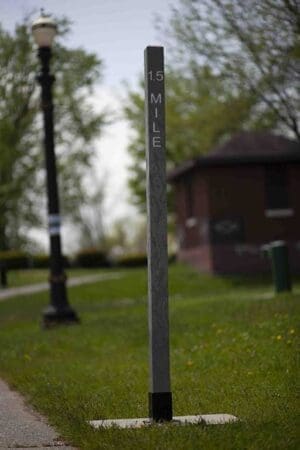 8ft Charcoal Mile Marker on river trail with distance on it for directions