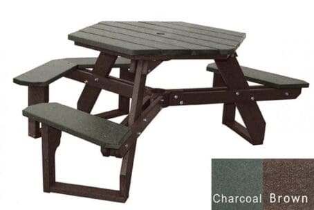 An Open Hexagon Universal Access picnic table with seating for 4 people plus a spot for wheelchair access. Made out of recycled HDPE plastic. Shown with a brown frame and charcoal top and seat boards.