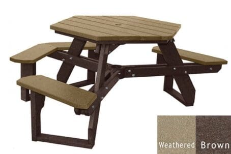 An Open Hexagon Universal Access picnic table with seating for 4 people plus a spot for wheelchair access. Made out of recycled HDPE plastic. Shown with a brown frame and weathered top and seat boards.