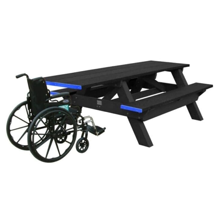 a Standard ADA outdoor commercial picnic table with wheelchair access on one end. Made with recycled HPDE plastic. Shown with a black frame and black top and seat boards.