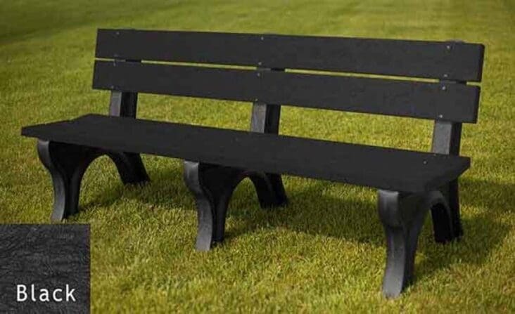 Traditional 6 foot outdoor park bench made with our sturdy and durable 2"x6" planks. Made of 100% recycled HDPE plastic. Shown on grass with a black frame and black boards.
