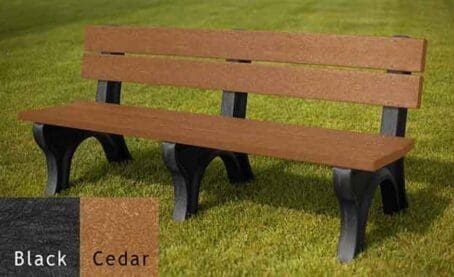 Traditional 6 foot outdoor park bench made with our sturdy and durable 2"x6" planks. Made of 100% recycled HDPE plastic. Shown on grass with a black frame and cedar boards.