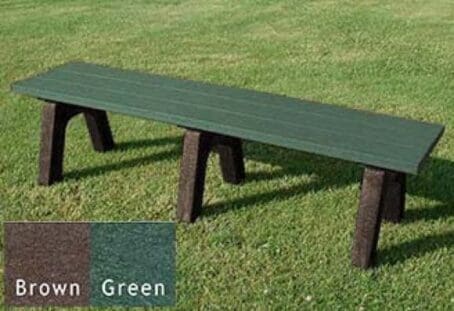6 ft Traditional commercial outdoor flat bench made with our strong and durable 2"x6" planks. Made from 100% recycled HDPE plastic. Shown on grass with a brown frame and green boards.
