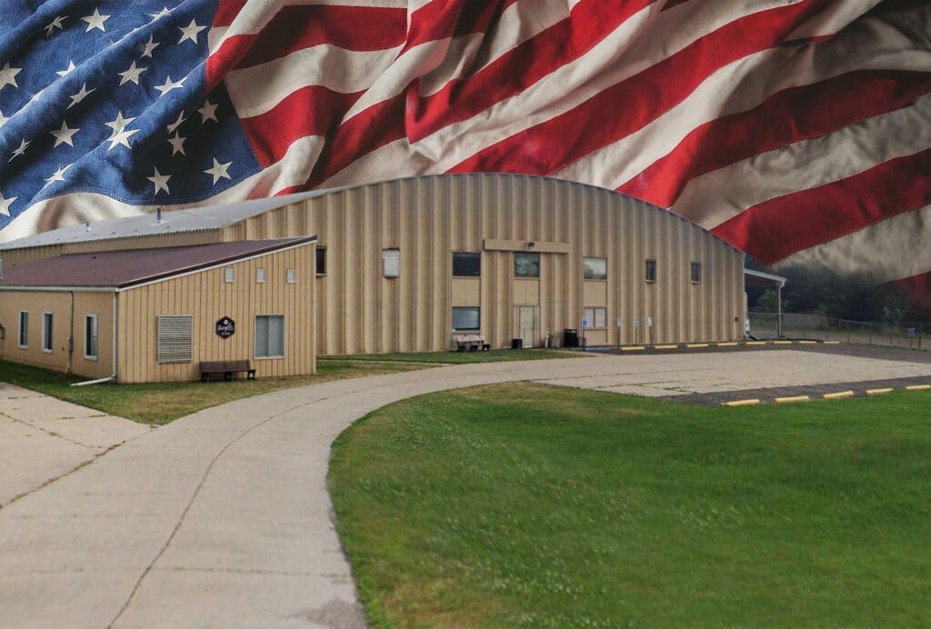Polly Products Building with American Flag Background