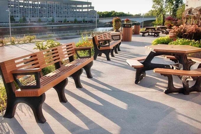 Elite 8ft Backed bench with arms and plaza table at Lansing Market