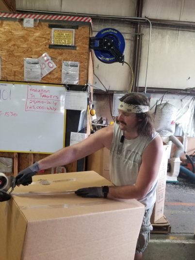 Steve seals the box of products ready to ship